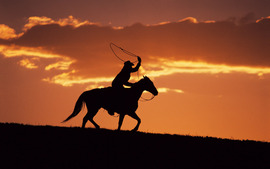 Western Cowboy At Sunset